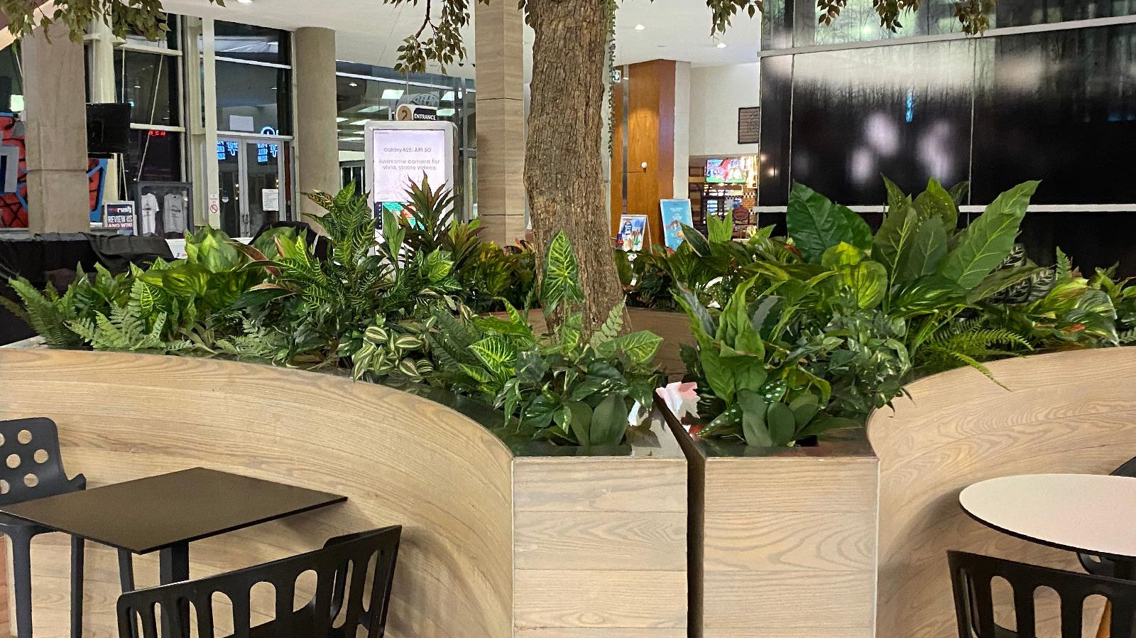 Artificial plant installation at greenstone shopping centre