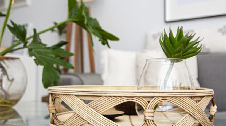 Styled coffee table with a decorative woven tray