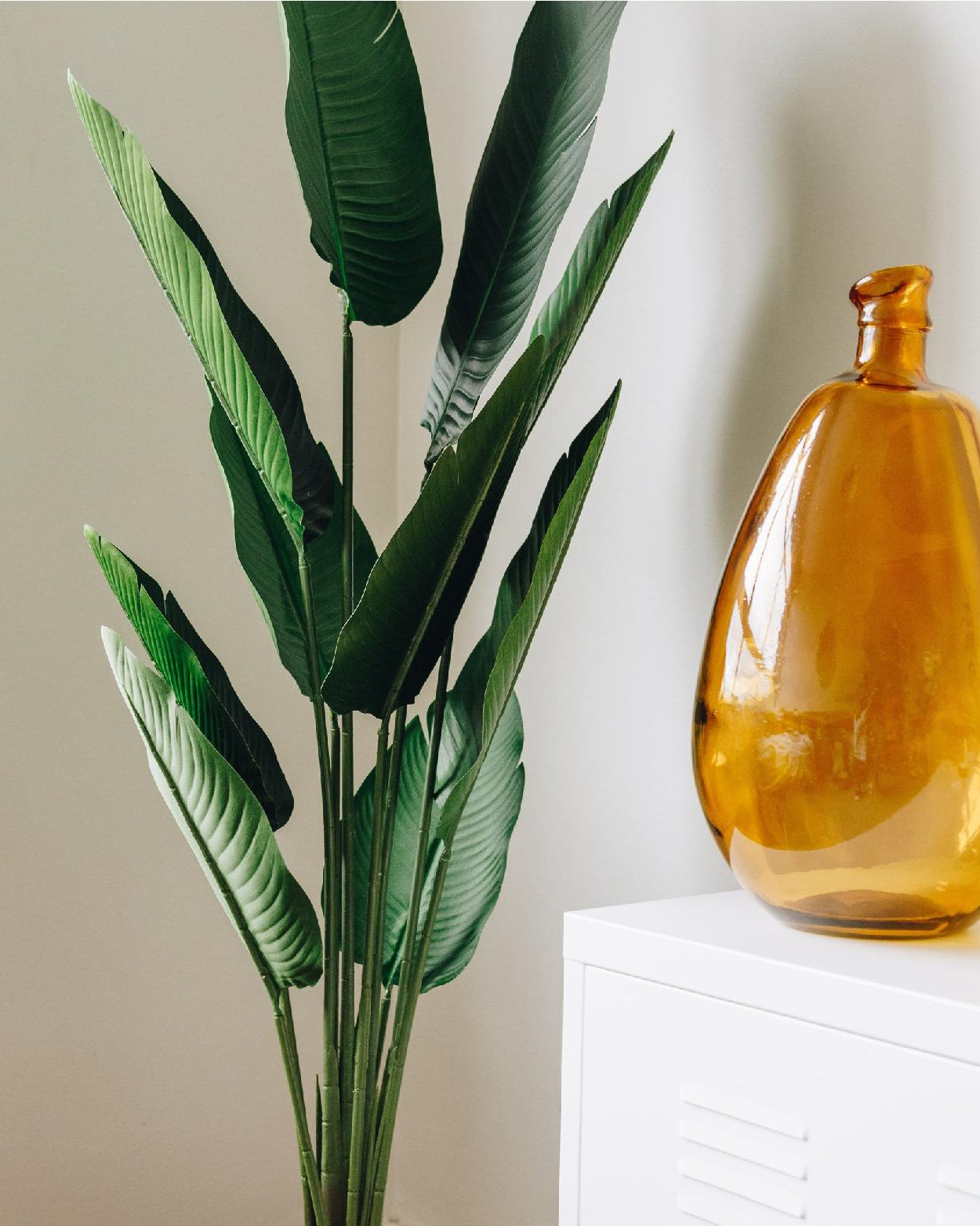 Artificial tree with a decorative vase