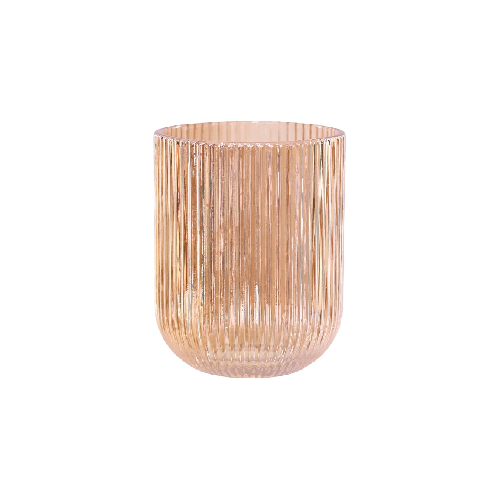 A ribbed glass drinking tumbler