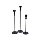 Set of three black metal candlesticks in varying heights