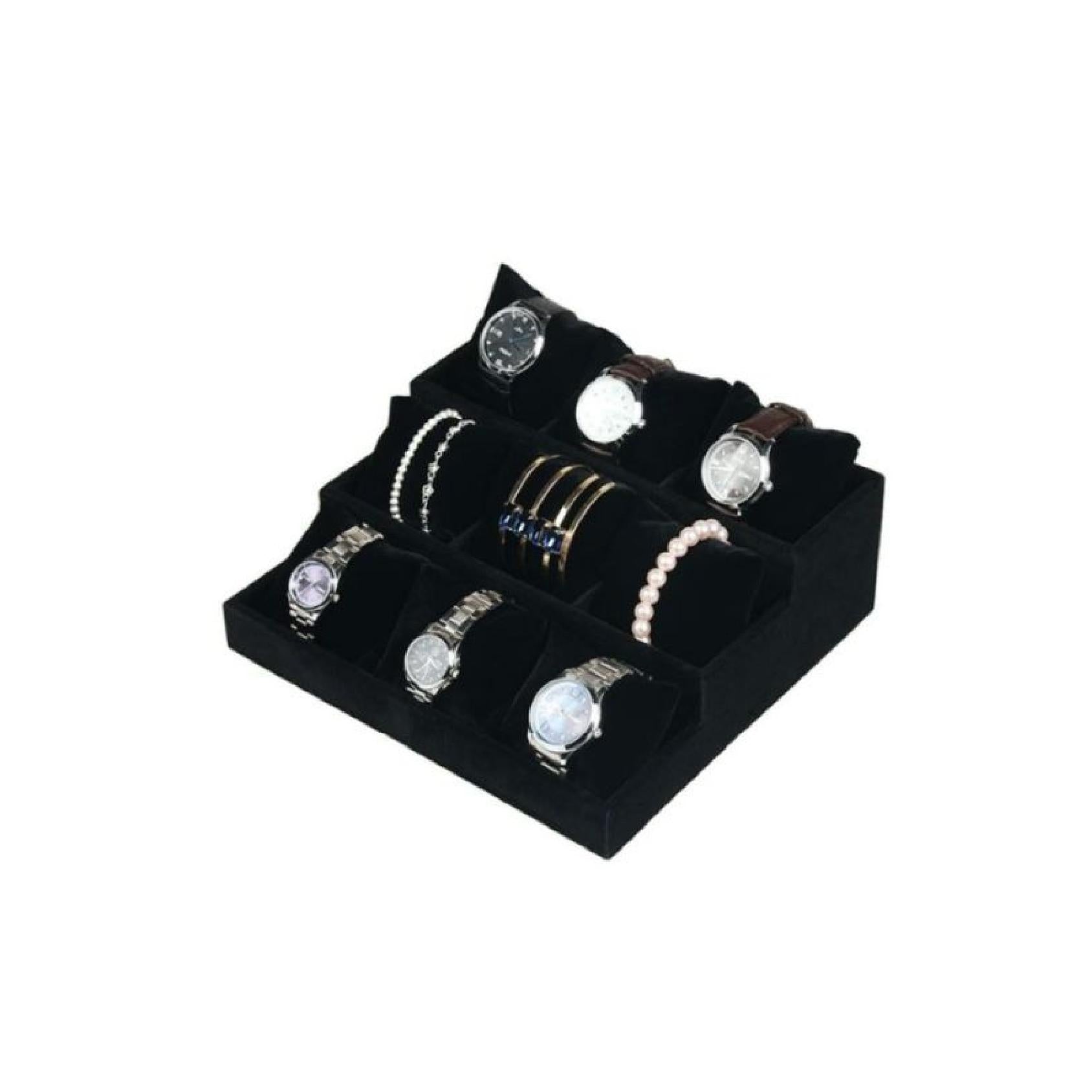 Black velvet tiered display stand with soft cushions holding watches & bracelets