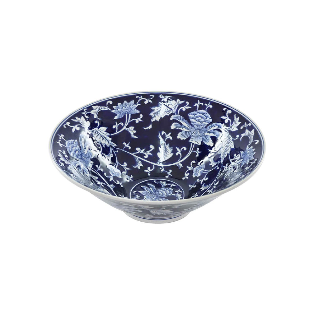 A blue and white ceramic bowl with an intricate floral pattern