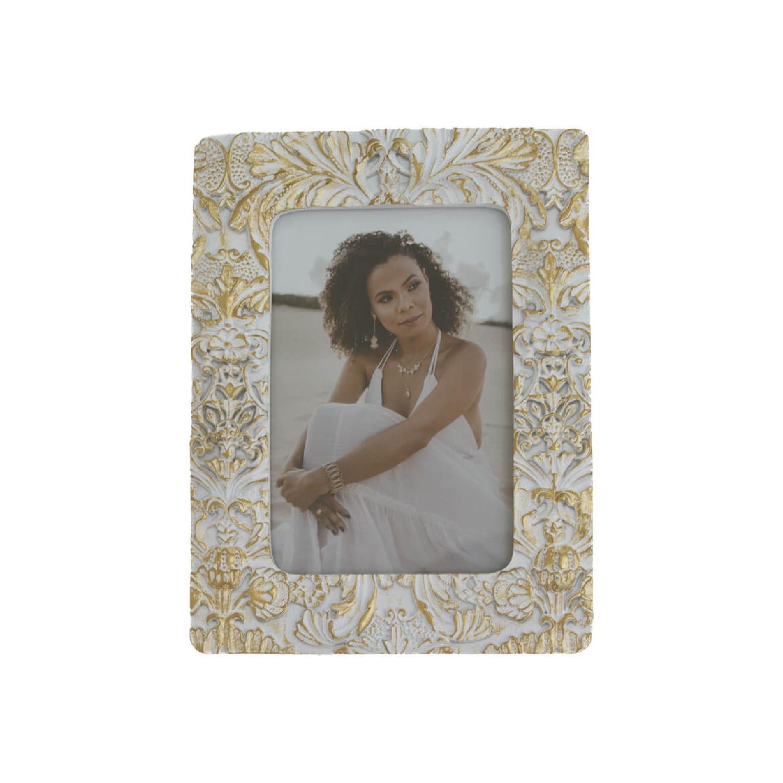 White and gold distressed picture frame