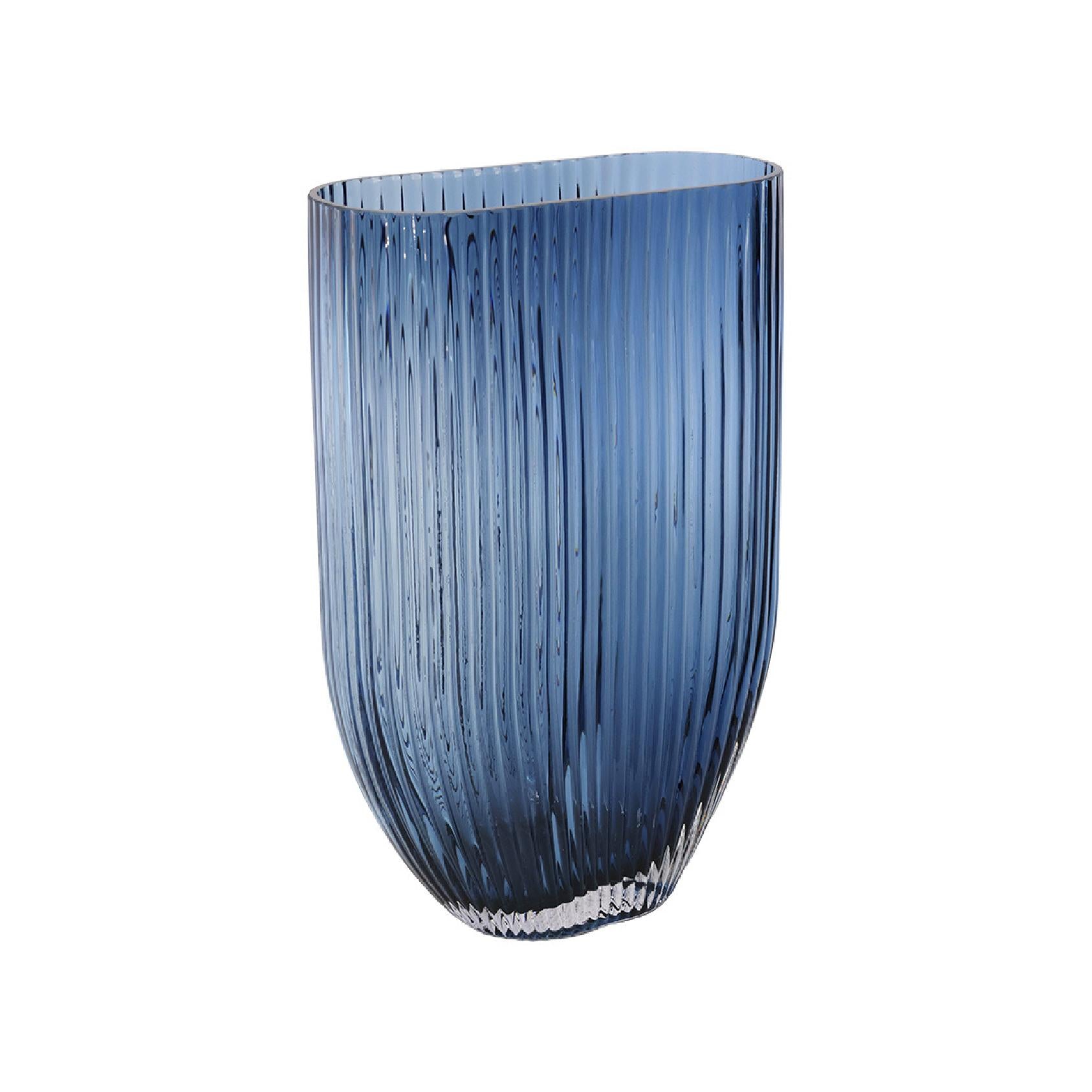 Blue glass vase with ribbed texture
