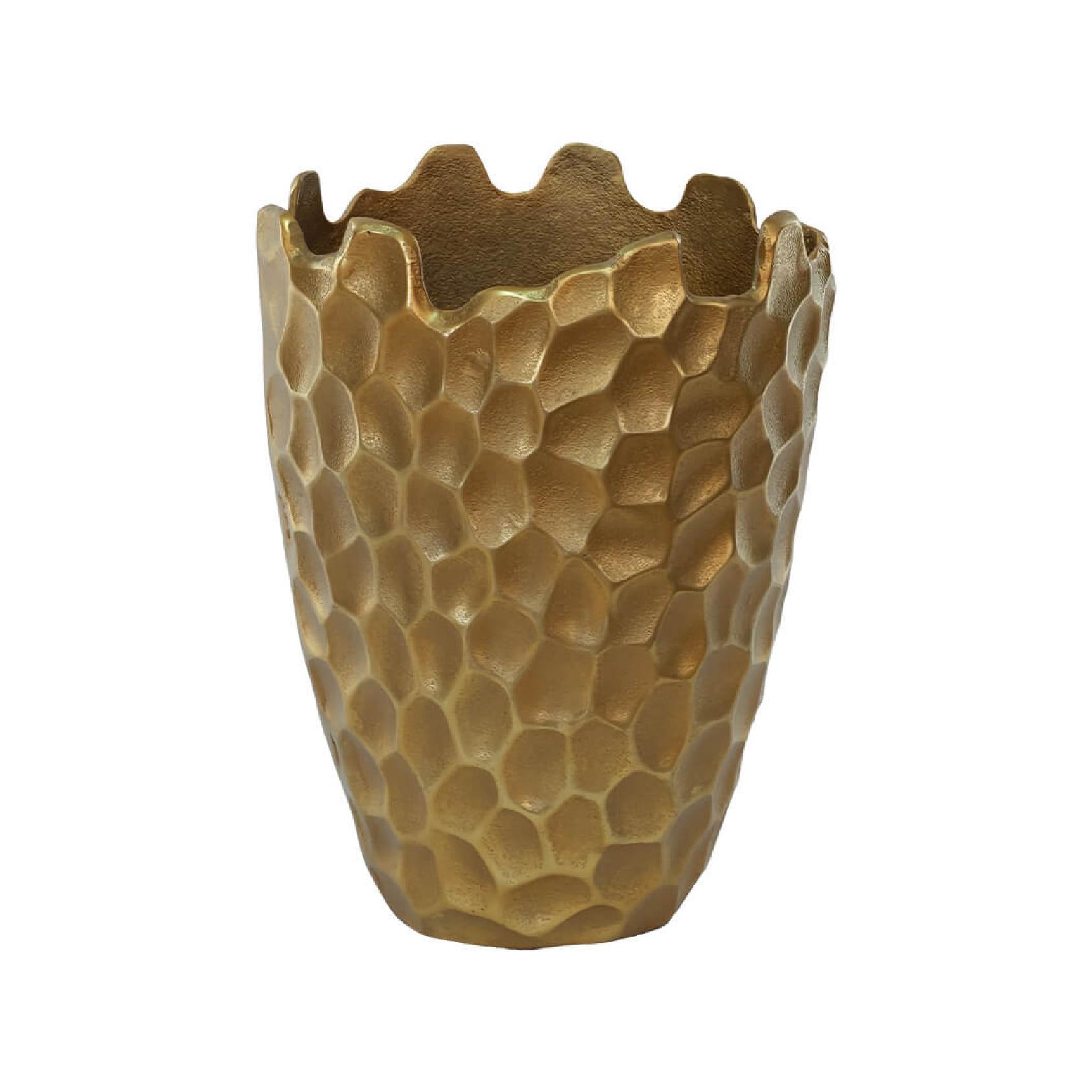 Gold textured metal vase on a white background