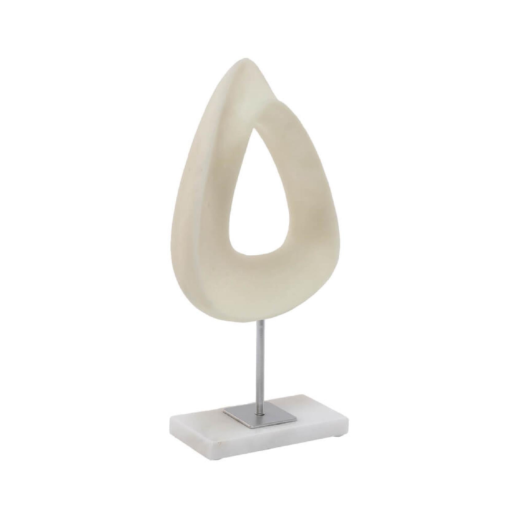 Decorative beige sculpture on a white marble base