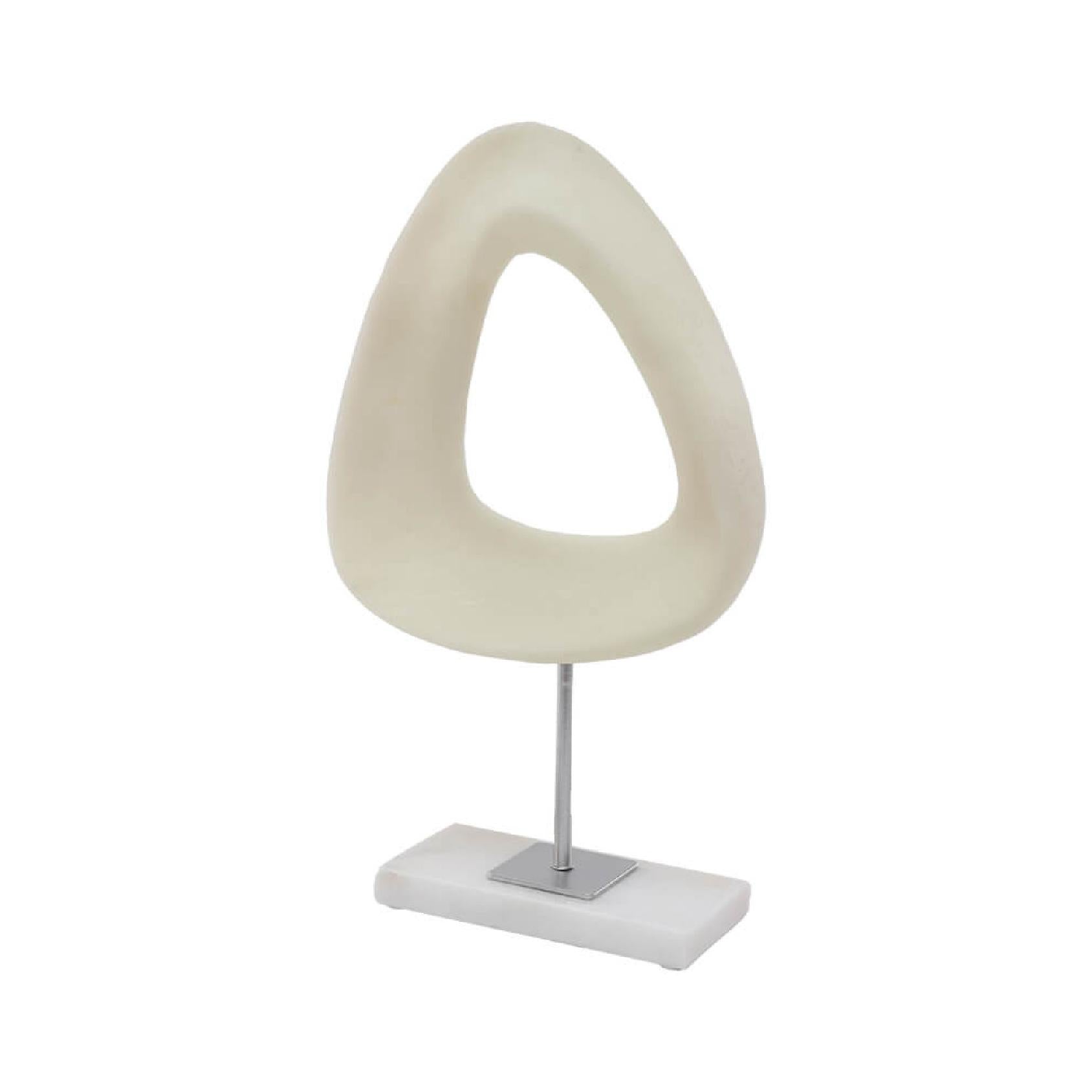 Decorative beige sculpture on a white marble base