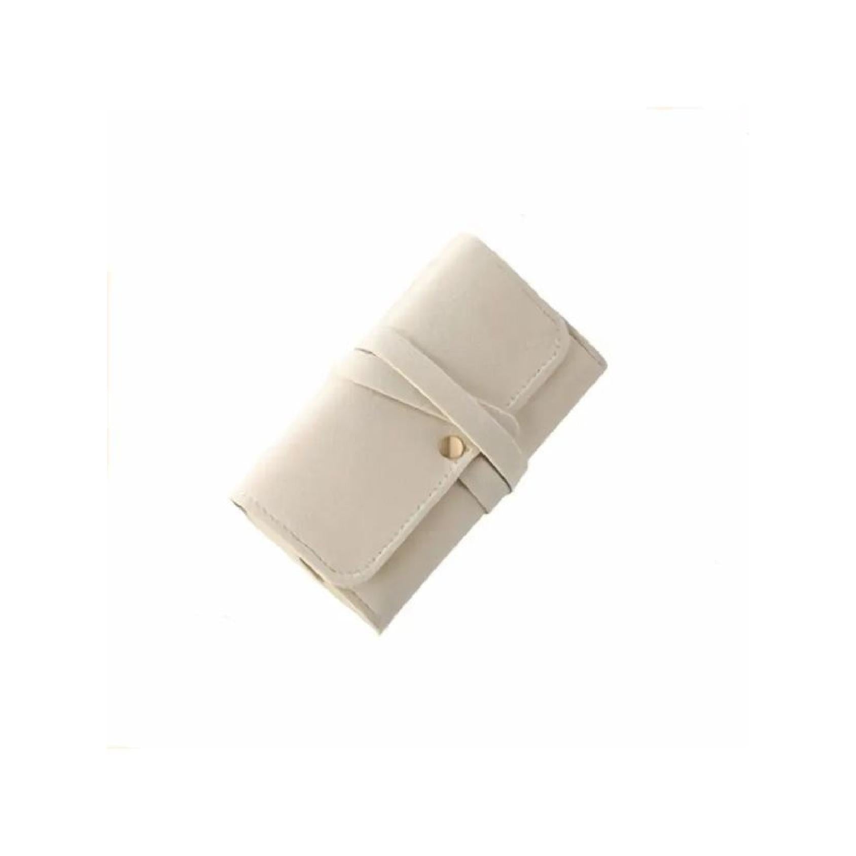 Ivory microfibre jewellery roll closed and tied with strap
