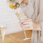 Champagne being poured into Nova glass flutes