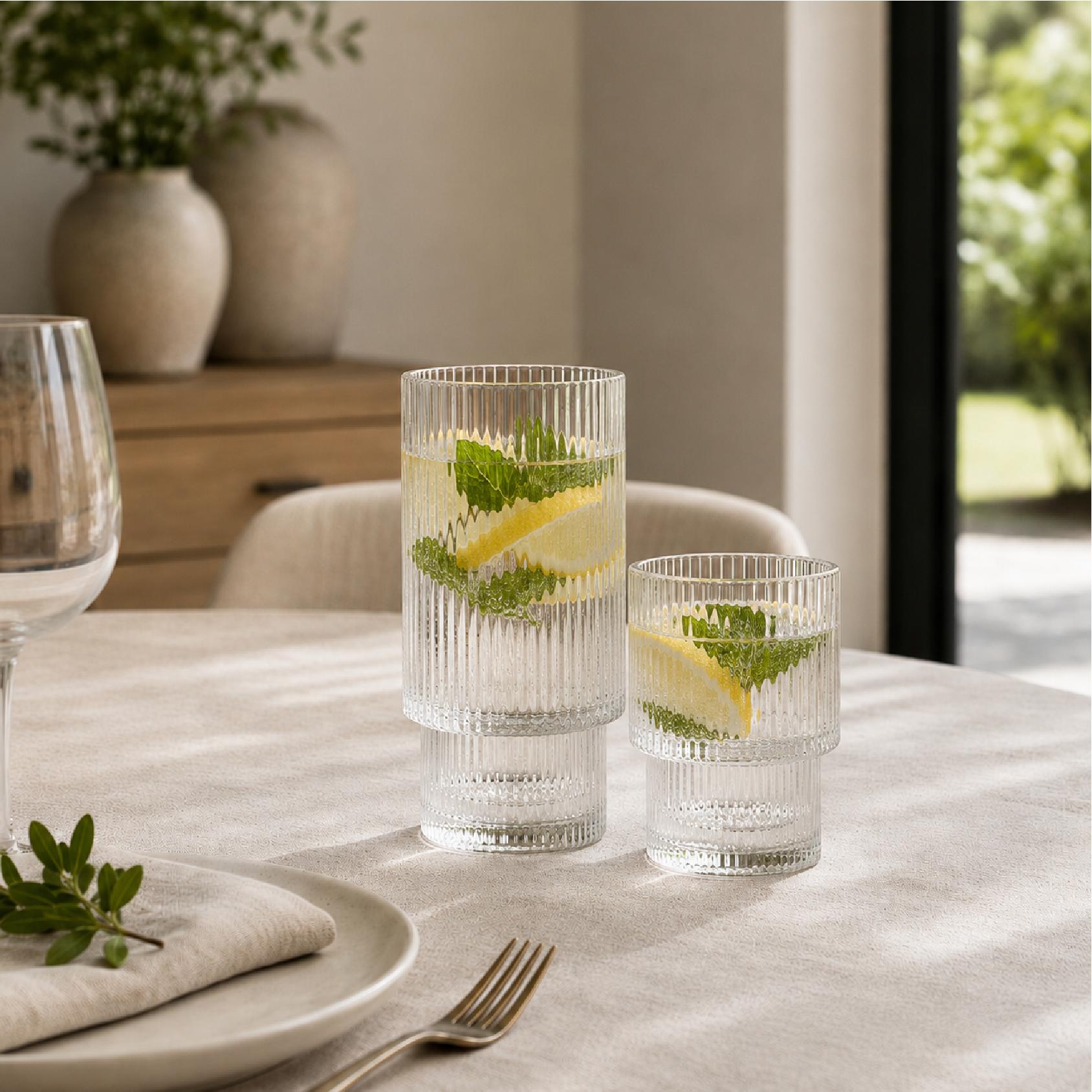 Ribbed glass hi-ball and tumbler on a dining table