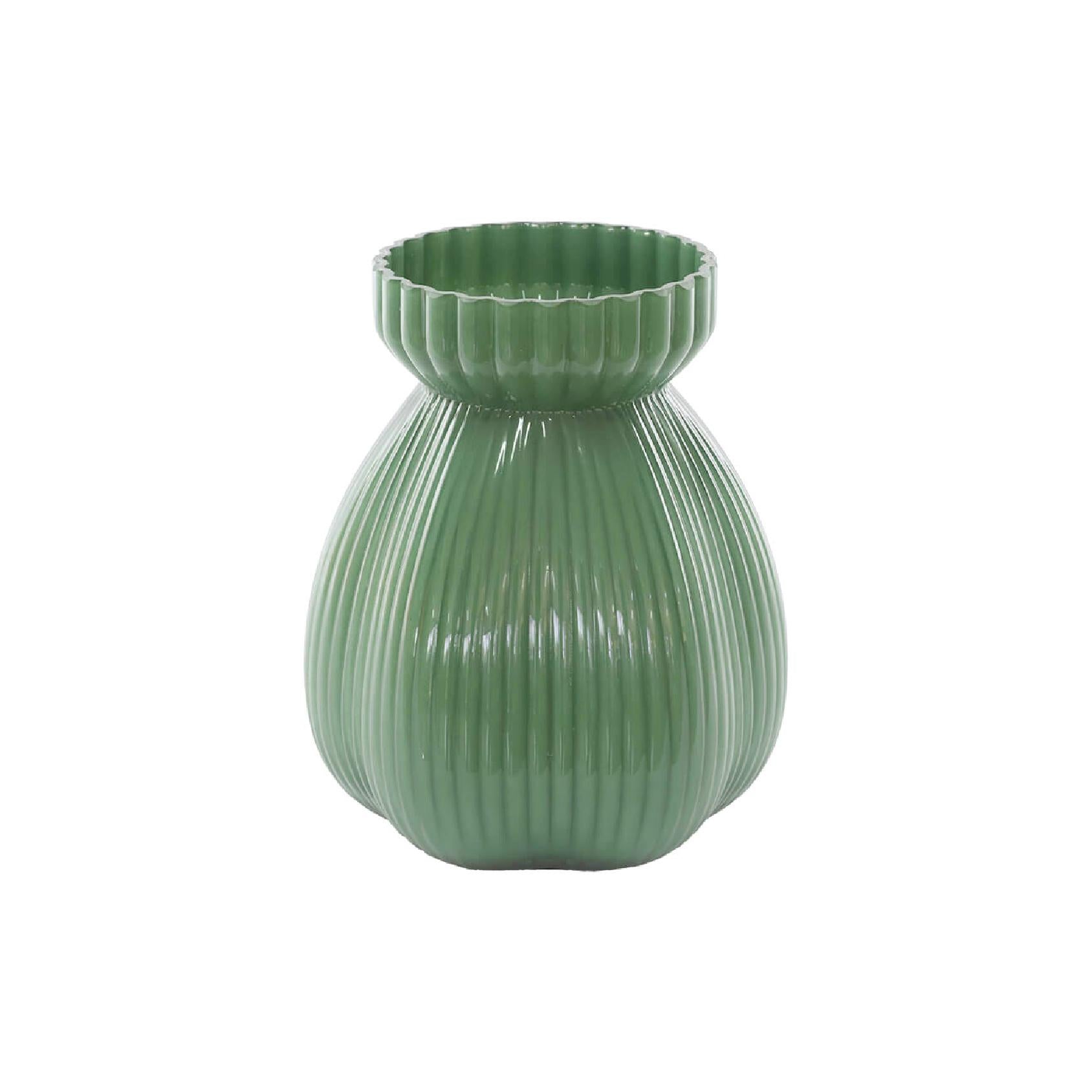 Sage green ribbed glass vase on a white background