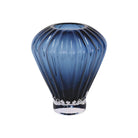 Blue fluted glass vase with vertical lines and pedestal base