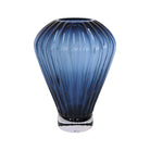 Blue fluted glass vase with vertical lines and pedestal base