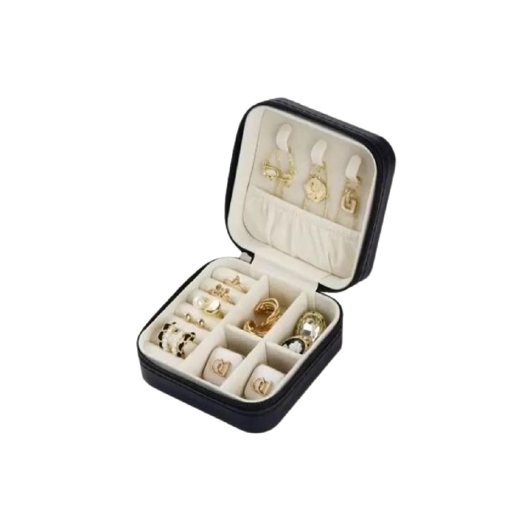 Black square zip-around jewellery travel case filled with jewellery