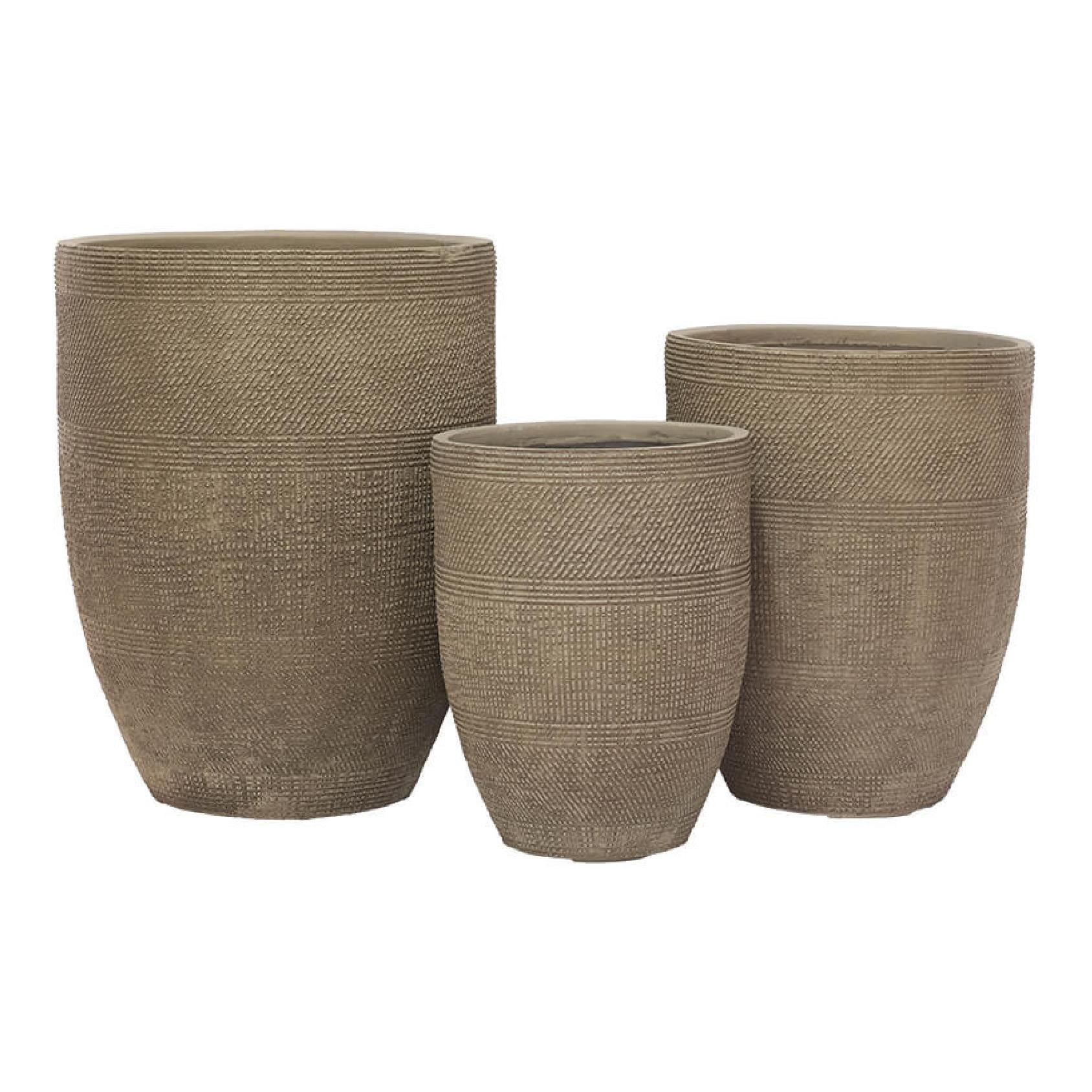 Three textured beige fibrestone planters of different sizes