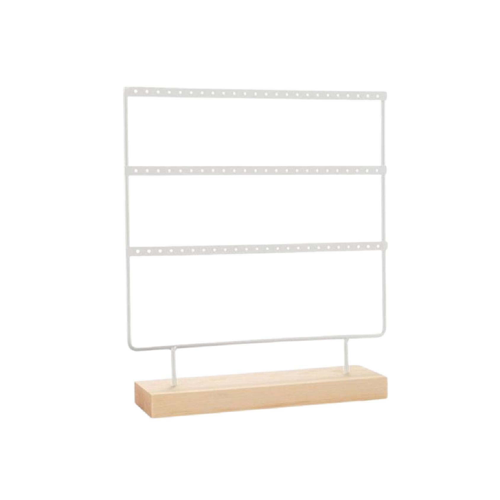 White metal earring stand with a natural wood base