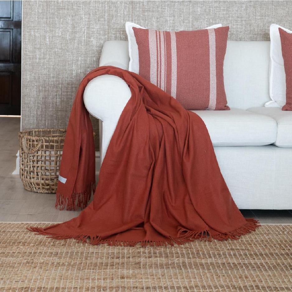 Styled burnt orange pure acrylic throw