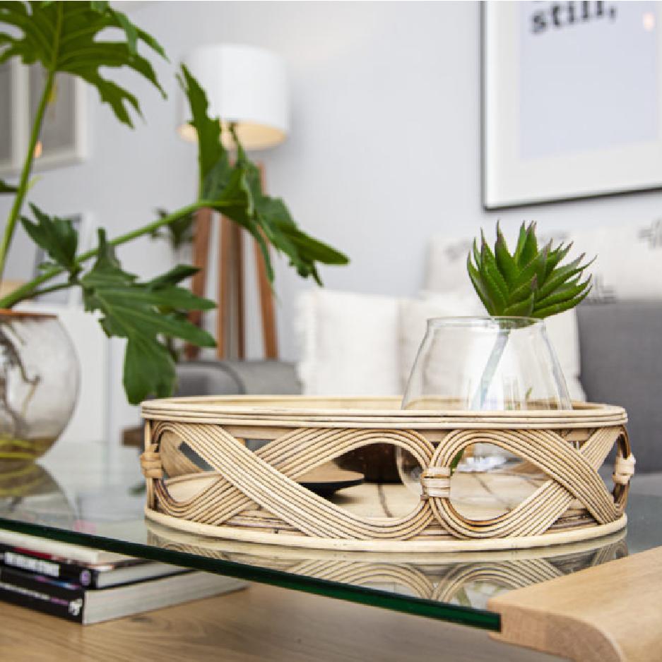 Styled coffee table with a decorative woven tray