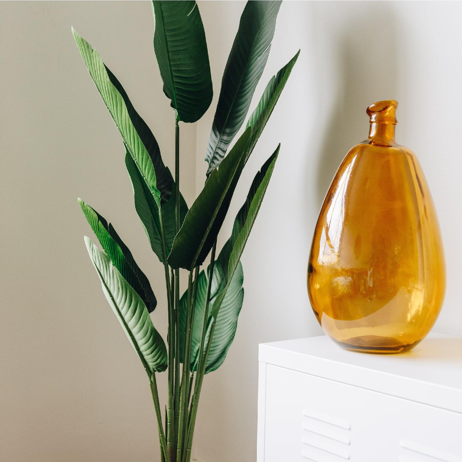 Artificial tree with a decorative vase