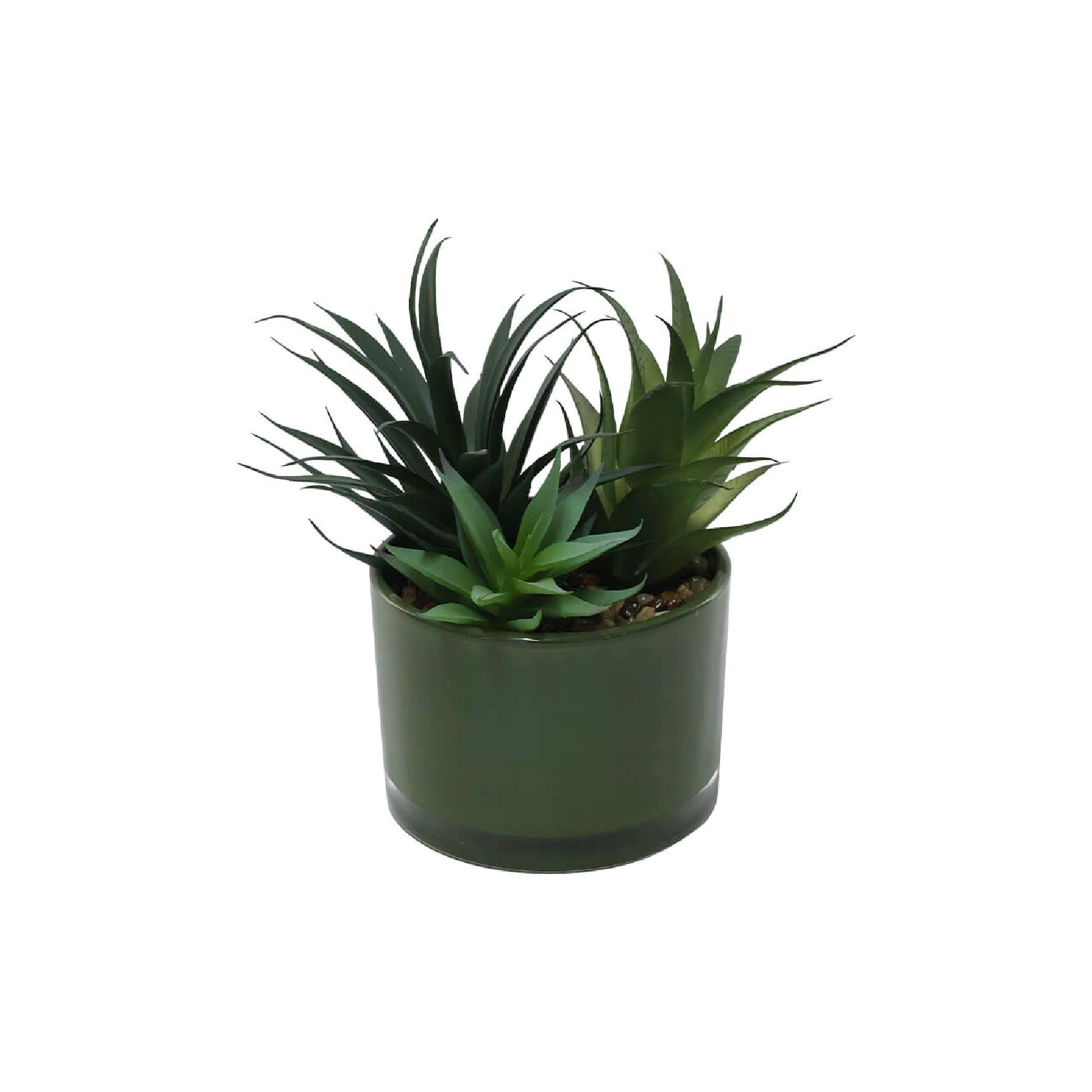 Artificial succulents in green ceramic pot