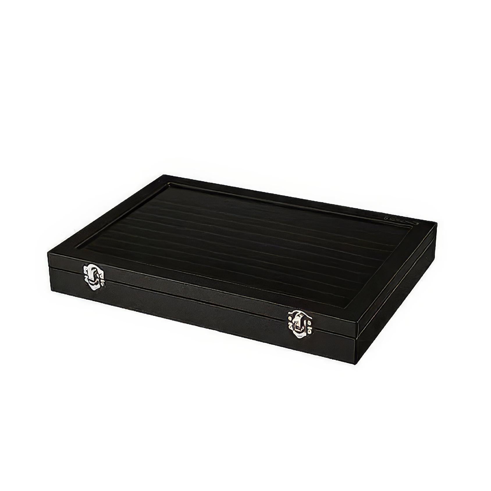 Closed black ring display case with sleek exterior and secure metal clasps