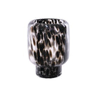 A black and white patterned glass vase