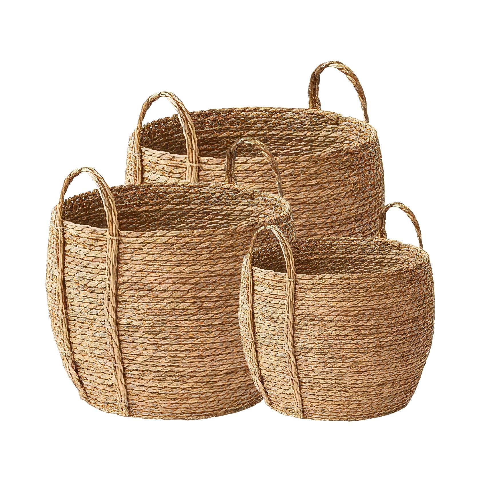 Set of three natural, braided seagrass baskets with a round shape and handles on a white background