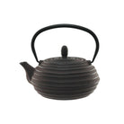 A dark brown cast iron teapot with circular ridges on the body and a black metal handle