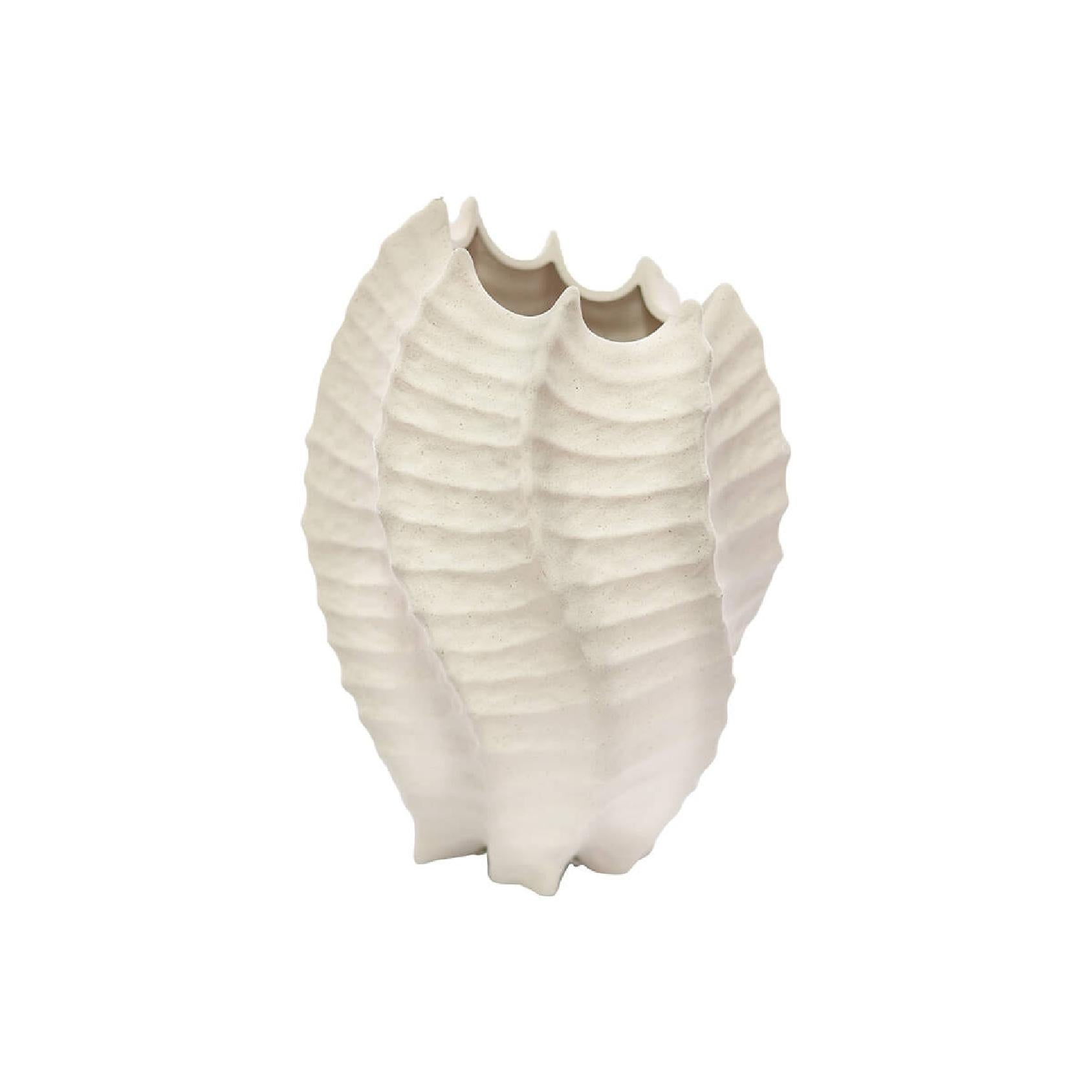 Textured cream ceramic vase shaped like a shell