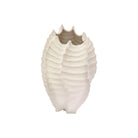 Textured cream ceramic vase shaped like a shell