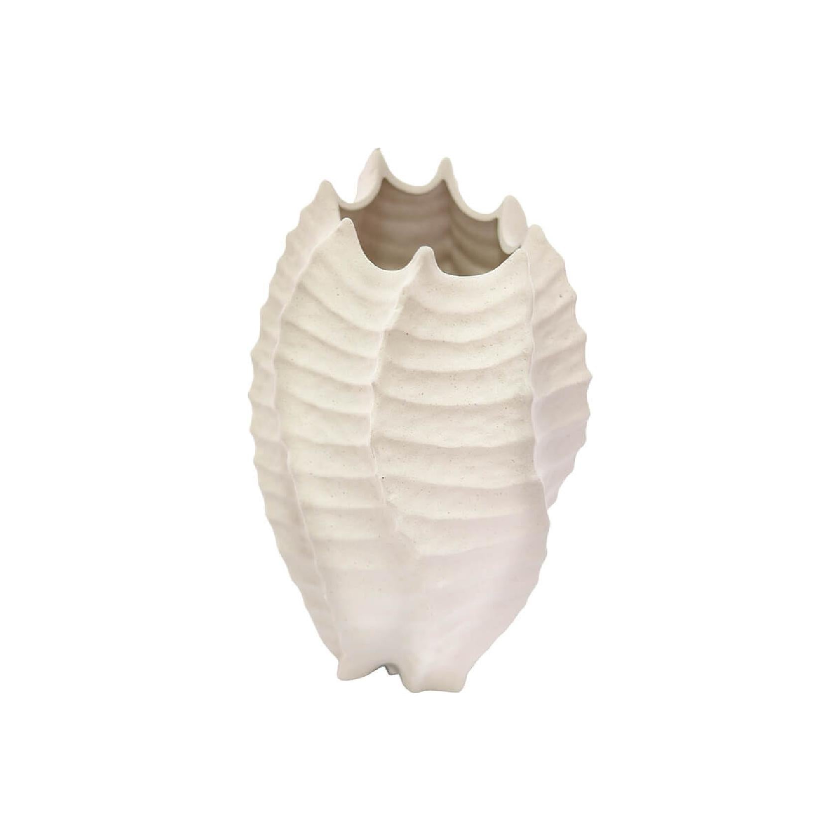 Textured cream ceramic vase shaped like a shell