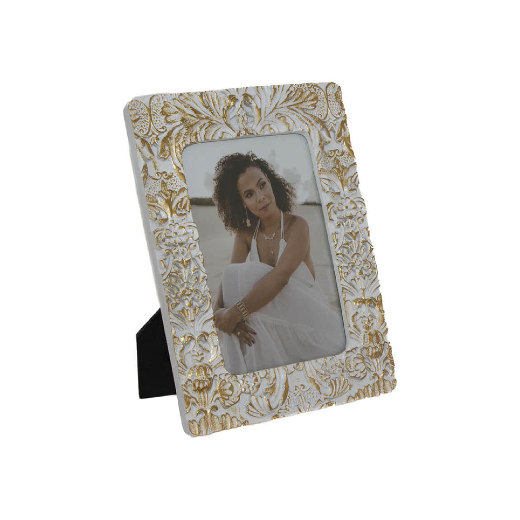 White and gold distressed picture frame