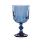 A blue wine glass with a vertical ribbed pattern