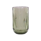 A ribbed green glass tumbler