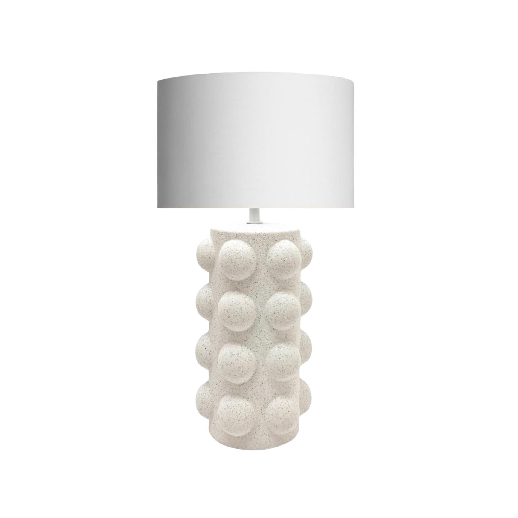 Table lamp with textured white base and white shade
