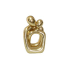 Gold abstract polystone sculpture of a couple 