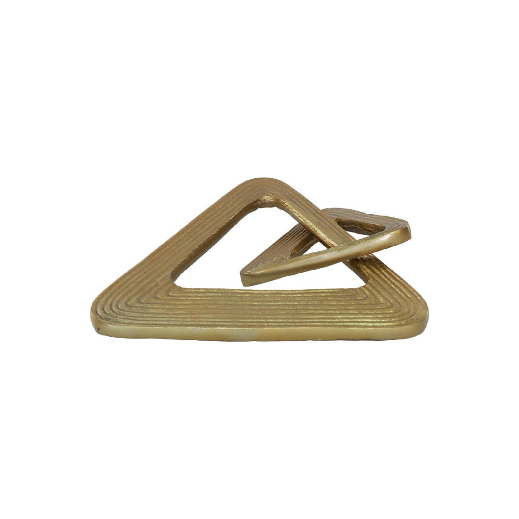 Gold metal decorative triangle object on a white background