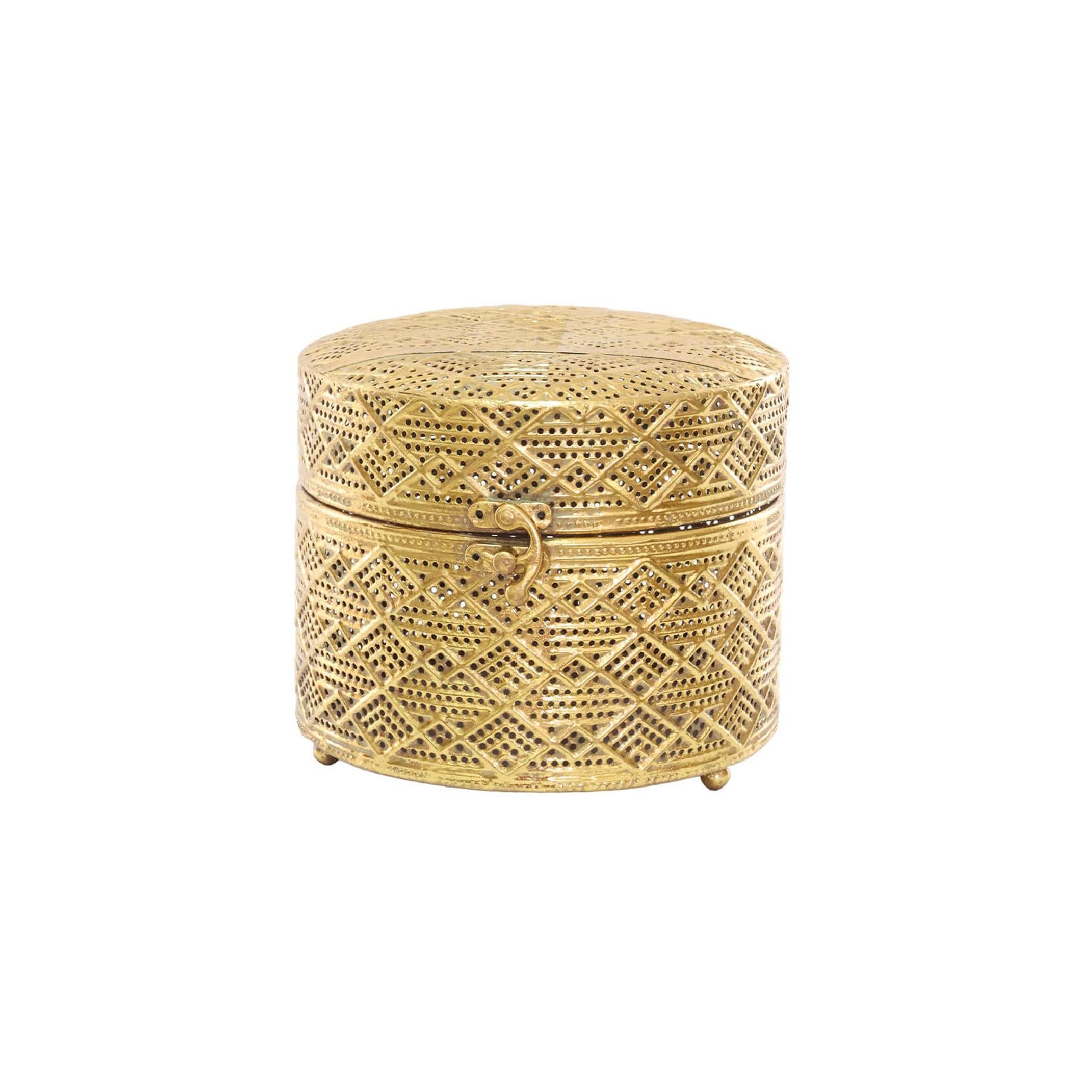 Gold lattice metal trinket box with hinged lid closed on a white background