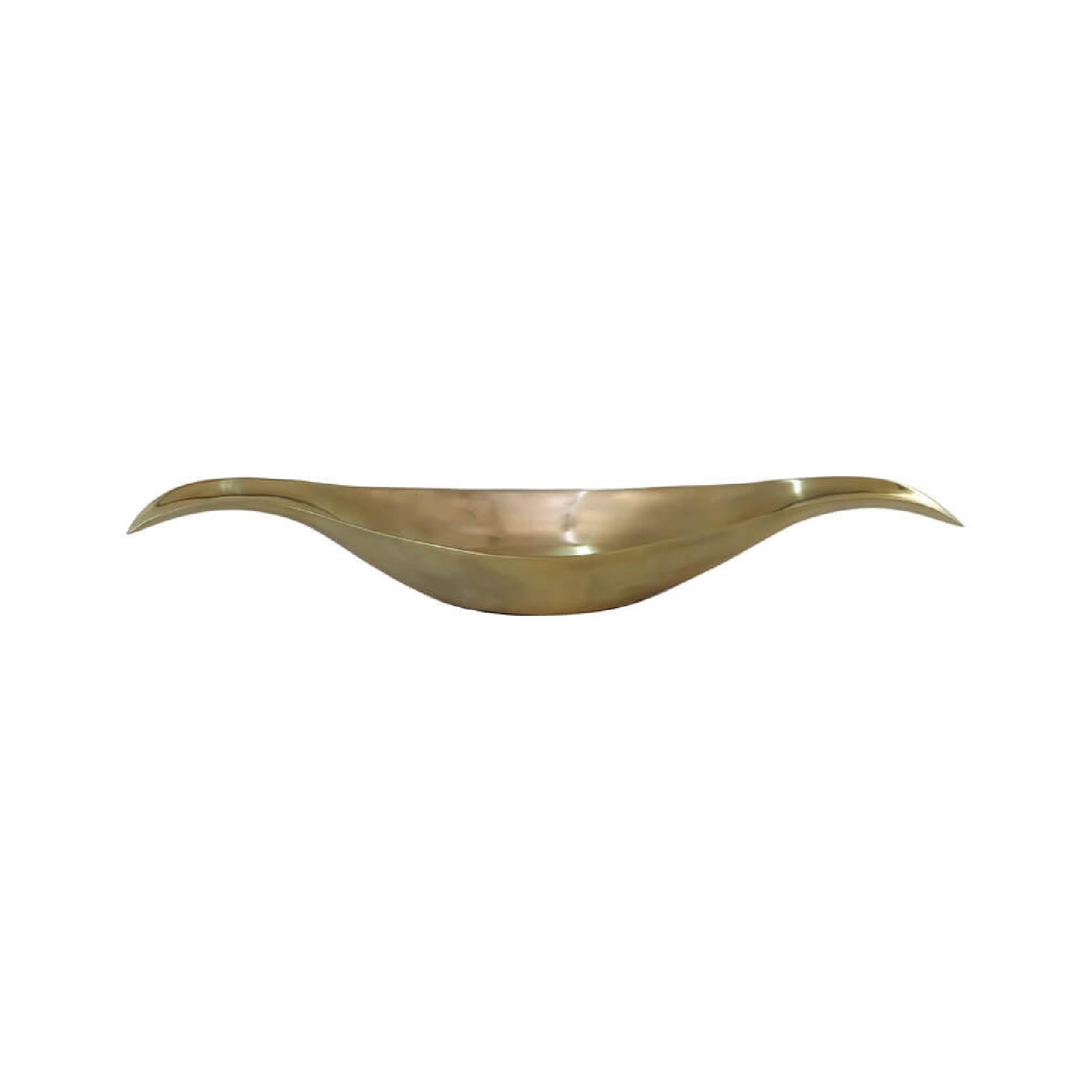 Elongated gold metal bowl with upturned edges