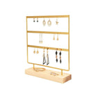Gold and natural wood earring holder