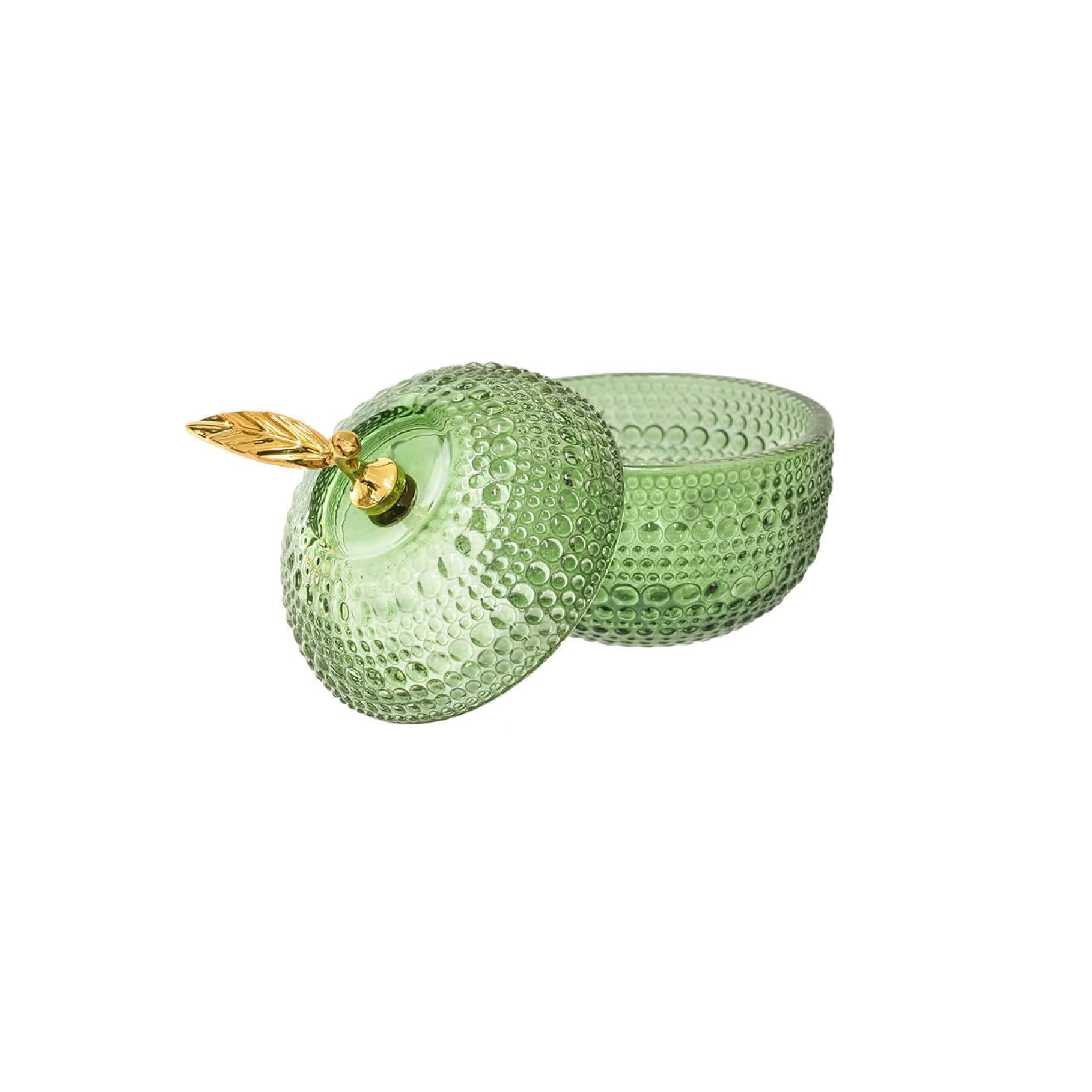 Green textured apple-shaped glass storage container with a gold leaf
