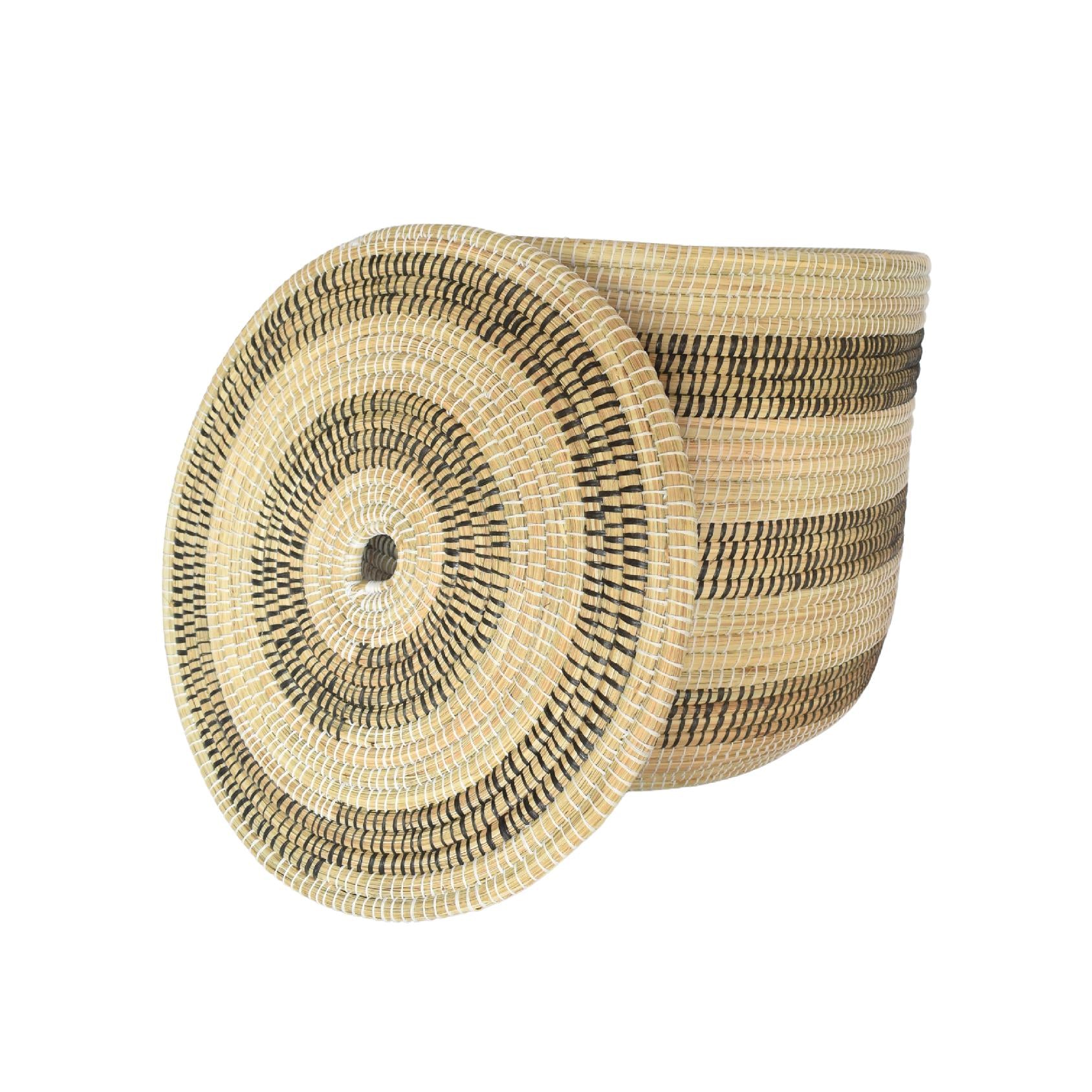 Woven basket with black stripes and a fitted lid