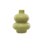 A small ceramic vase with a glossy green glaze