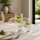 Ribbed glass hi-ball and tumbler on a dining table