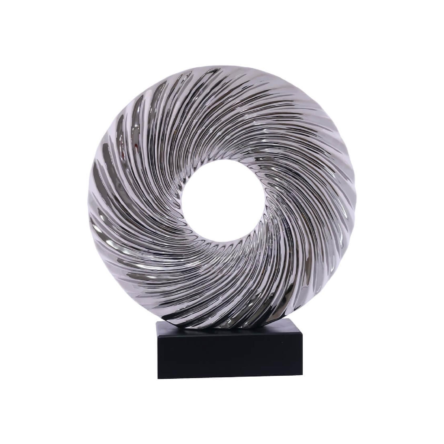 Decorative sculpture with a spiral design on a black base