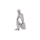Silver ceramic thinking figurine