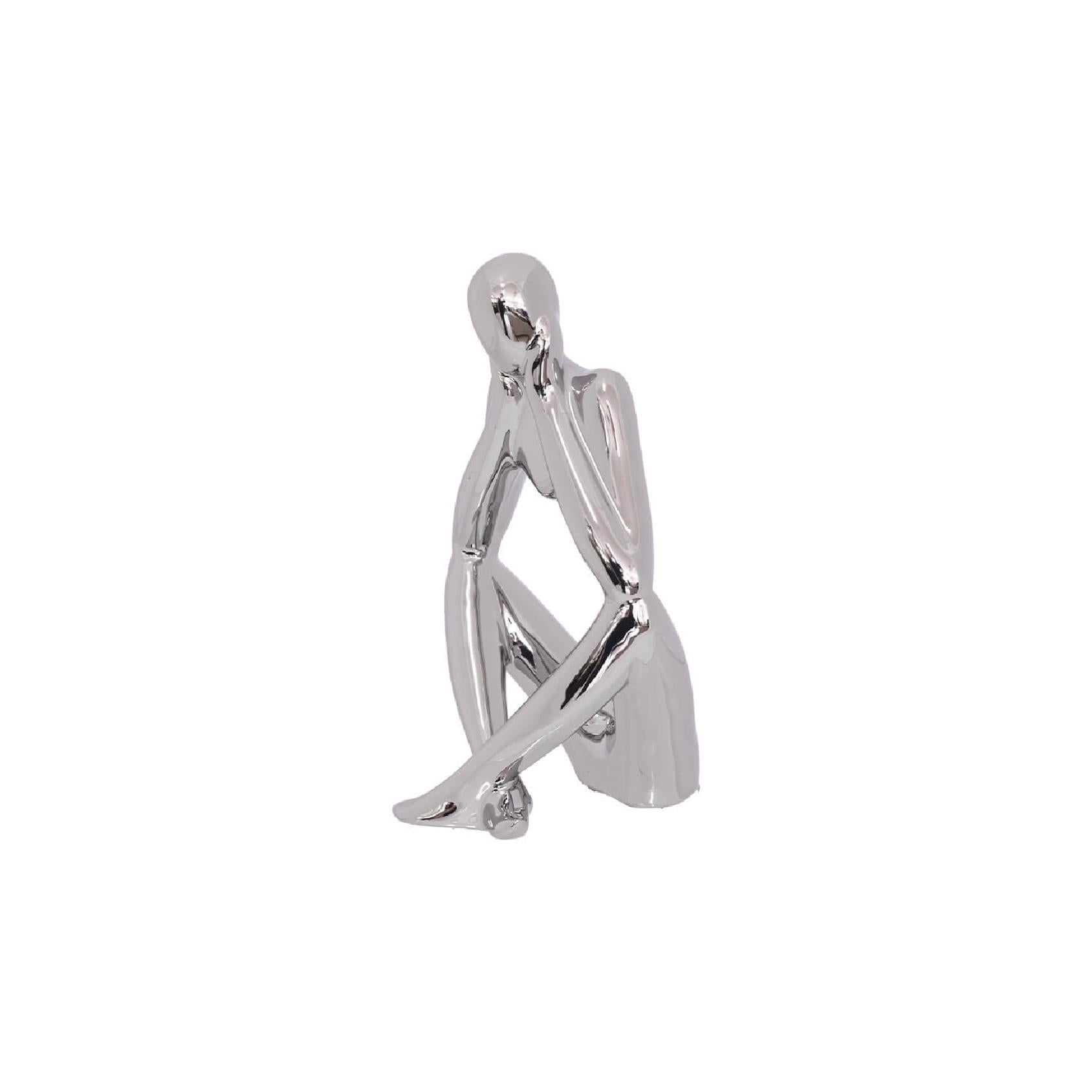 Silver ceramic thinking figurine