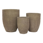Three textured beige fibrestone planters of different sizes