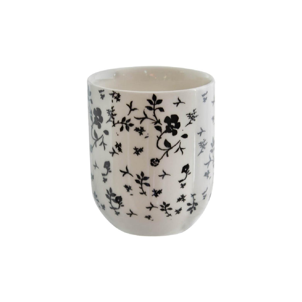 White and black floral ceramic teacups